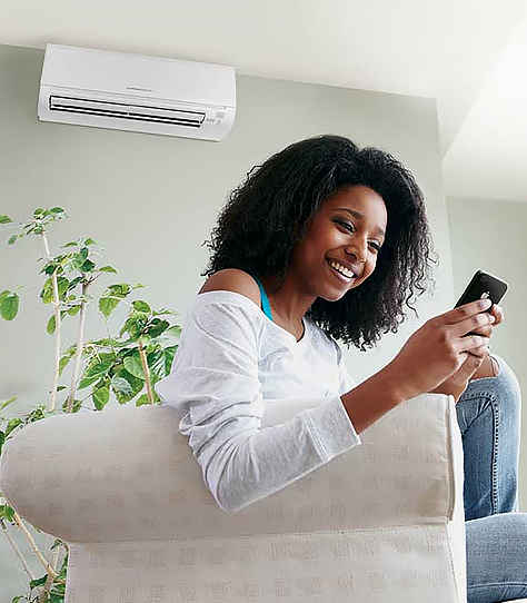 Woman enjoying AC at home on the couch